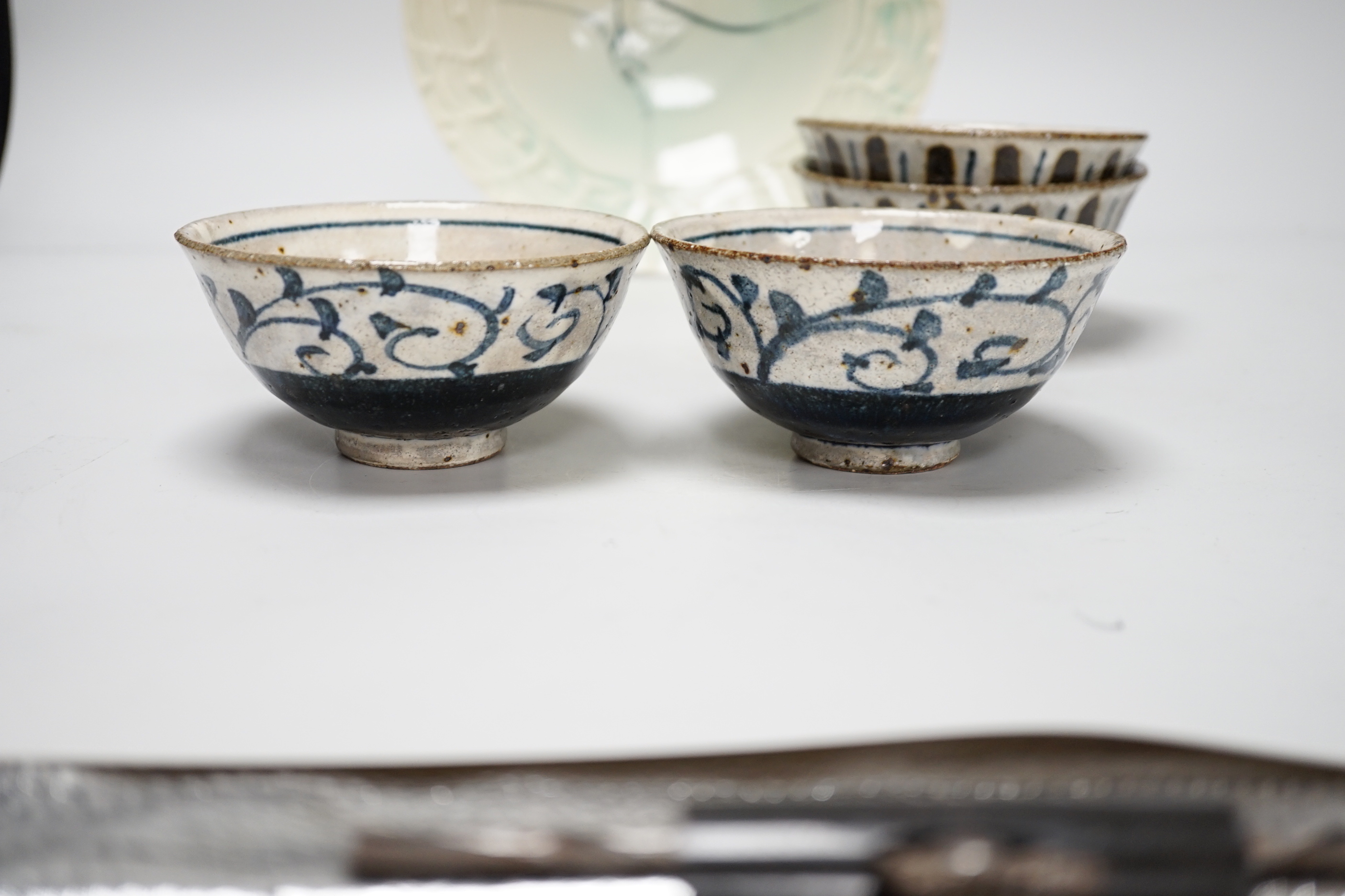 Two pairs of Japanese studio pottery bowls, a European studio bowl and similar ceramic mask raised on hexagonal base, the largest 33cm high